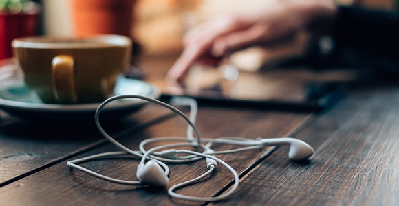 Closeup of earbuds on table